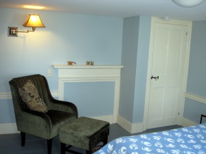 The second floor bedroom on the east side also has a comfy sitting/reading area, next to the old mantel.  The door is original to the house, and is beautifully hand-planed.