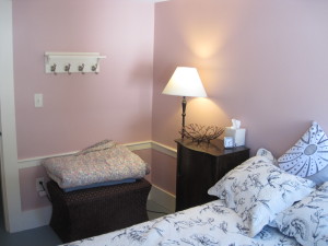 This bedroom has a beautiful old mirror (to left, not shown), some space to hang clothes, an ottoman with extra blankets inside, and also that you can set your suitcase on, turkish rug (not shown) and bed-side tables with reading lamps.